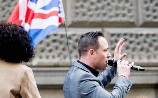  Daniel Thomas speaks at the demonstration he organised outside the Old Bailey while Tommy Robinson appears at a hearing Credit: Rmv/Zuma Press / eyevine 